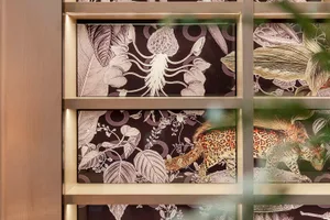 Decorative jungle-themed fabric wall panels with animals and botanical patterns.