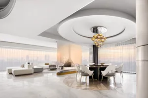 Modern dining room with marble floor and ceiling, featuring a round dining table and chairs, large windows with city view.