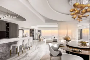 Modern kitchen featuring marble countertops and glass elements