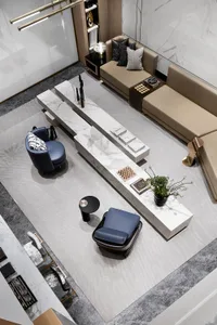 A modern living room featuring a sleek marble centerpiece with a dark armchair and a beige sofa.