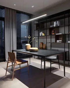 Modern industrial office desk with metal frame, wooden chair, black table surface, and glass vases.