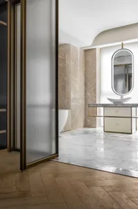 Modern design bathroom with marble and brass finishes
