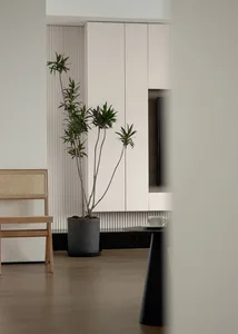 Minimalist living room featuring marble and wood furniture, and concrete flooring.