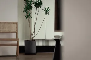A minimalist living room featuring a modern floating shelf.