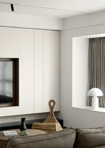 Minimalist living room with neutral tones, sleek furniture, and clean lines.