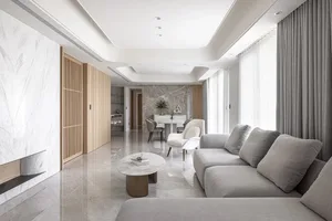 Modern minimalist living room with marble floor and leather furniture