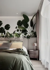 A serene minimalist bedroom featuring textured walls, a bed with various pillows, a wooden bedside table with a lamp, and lar
