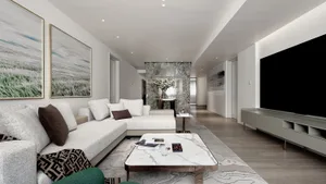 Modern apartment interior with a marble living room featuring a large sectional sofa and coffee table.