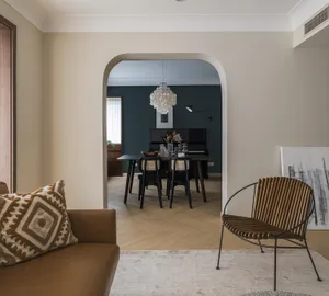 Modern living room featuring leather and woven furniture with minimalist decor.