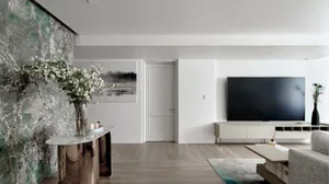 Modern living room with marble accents and minimalist design.