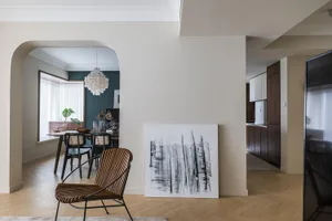 Modern living room featuring wooden furniture and decor elements.