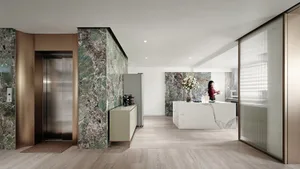 A modern living room featuring marble walls and flooring.