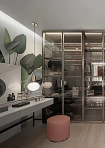 Modern interior design featuring a glass and metal wardrobe room with sleek lines and minimalistic style.