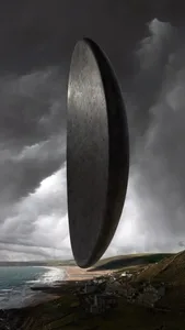 A massive, black, floating monolith with a smooth, round surface contrasts against a dramatic, stormy sky and a coastal lands