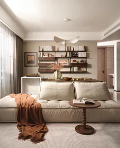 Minimalist living room with a white sofa, wooden coffee table, and eclectic rustic decor.