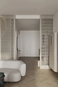 A minimalist living room with neutral-toned materials and modern furniture.