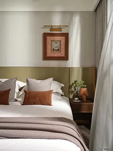 A well-designed bedroom featuring modern textiles and leather