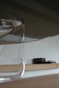 A well-designed living room featuring modern furniture made of glass with sleek lines and minimalist design.