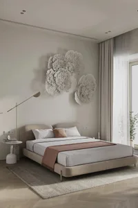 A minimalist bedroom featuring neutral fabrics and white walls.