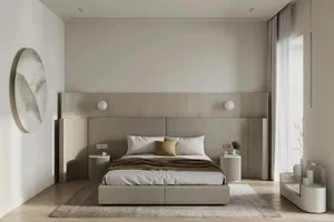 A modern, minimalist bedroom with neutral-toned furniture, a large window, and a large abstract painting.