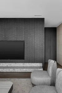 Industrial-style living room featuring concrete walls and marble floor.