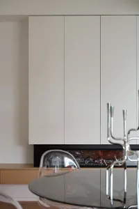 Modern kitchen featuring glass cabinets and countertops