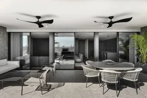 Modern living room with concrete, glass, and metal accents.