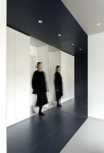 Blurred image of a modern minimalist flat with concrete and glass elements