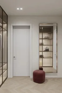 Modern, minimalist closet interior with white doors and glass shelves.