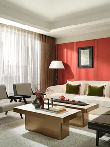 Modern living room featuring brass and marble accents