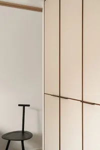 A minimalist wardrobe closed with a fabric door