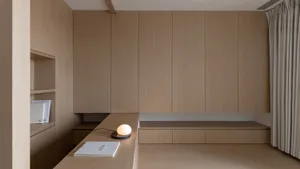 A minimalist interior design featuring natural wood elements and clean lines.