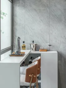 A modern bar station featuring a concrete and marble countertop with seating and a sleek design.