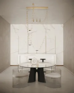 A modern dining room featuring a glass table, marble wall, and acrylic chairs.