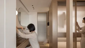 People selecting clothes from a modern interior clothing rack studio