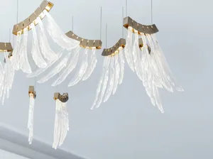 Modern art installation featuring glass crystals hanging from the ceiling, creating a visually striking centerpiece for a con