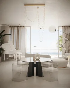 Modern living room featuring glass dining table, upholstered seating, and wooden accents.