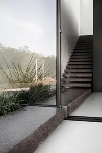 Modern stairs constructed from granite material outdoors.
