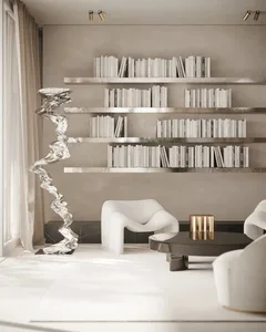 A modern living room featuring a metallic shelf on a concrete wall and floor.