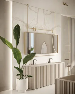 Modern minimalist bathroom featuring a marble sink, mirror, and green plant.