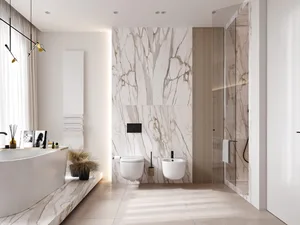 A modern bathroom with marble walls and flooring, featuring a freestanding bathtub, toilet, bidet, and minimalist design elem