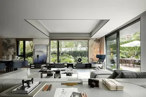 A modern residential interior featuring marble elements and a spacious layout.