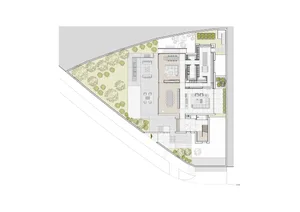 A modern living space with concrete tiles and floor plan diagram showing various rooms and layout.