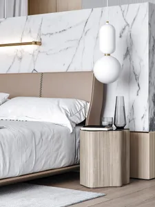A modern minimalist bedroom with a marble wall, wooden floor, and a bed with a leather headboard.