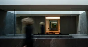 Modern bathroom with black marble walls
