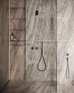 Contemporary bathroom featuring marble walls and minimalist design.