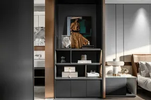 A modern bedroom featuring a black metallic shelf with a model, books, and decorative items.