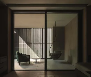 Modern residential balcony featuring metallic railings.