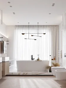 A modern residential bathroom featuring white marble walls, floor, and bathtub, with glass shower enclosure and white fixture