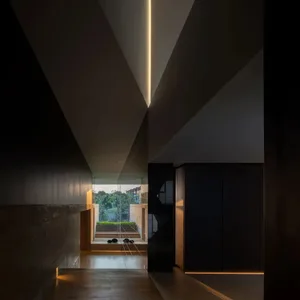 A modern interior space featuring concrete walls and floors.